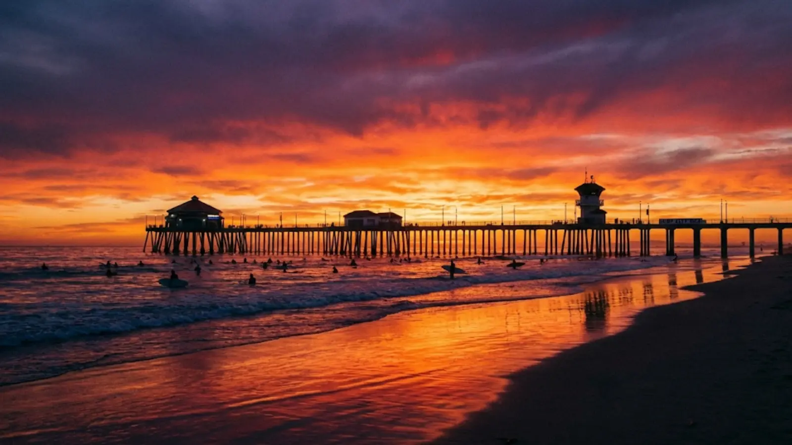 Sunset view of Long Beach marina with the Queen Mary ship in the background.